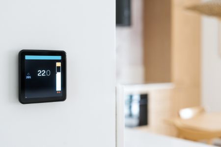 Thermostat on wall - black