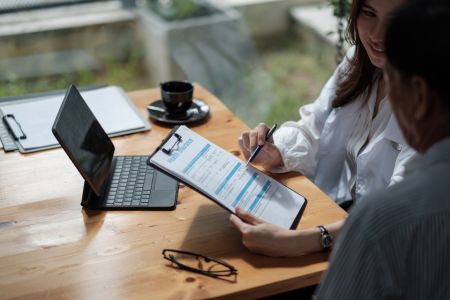 two people looking at paperwork